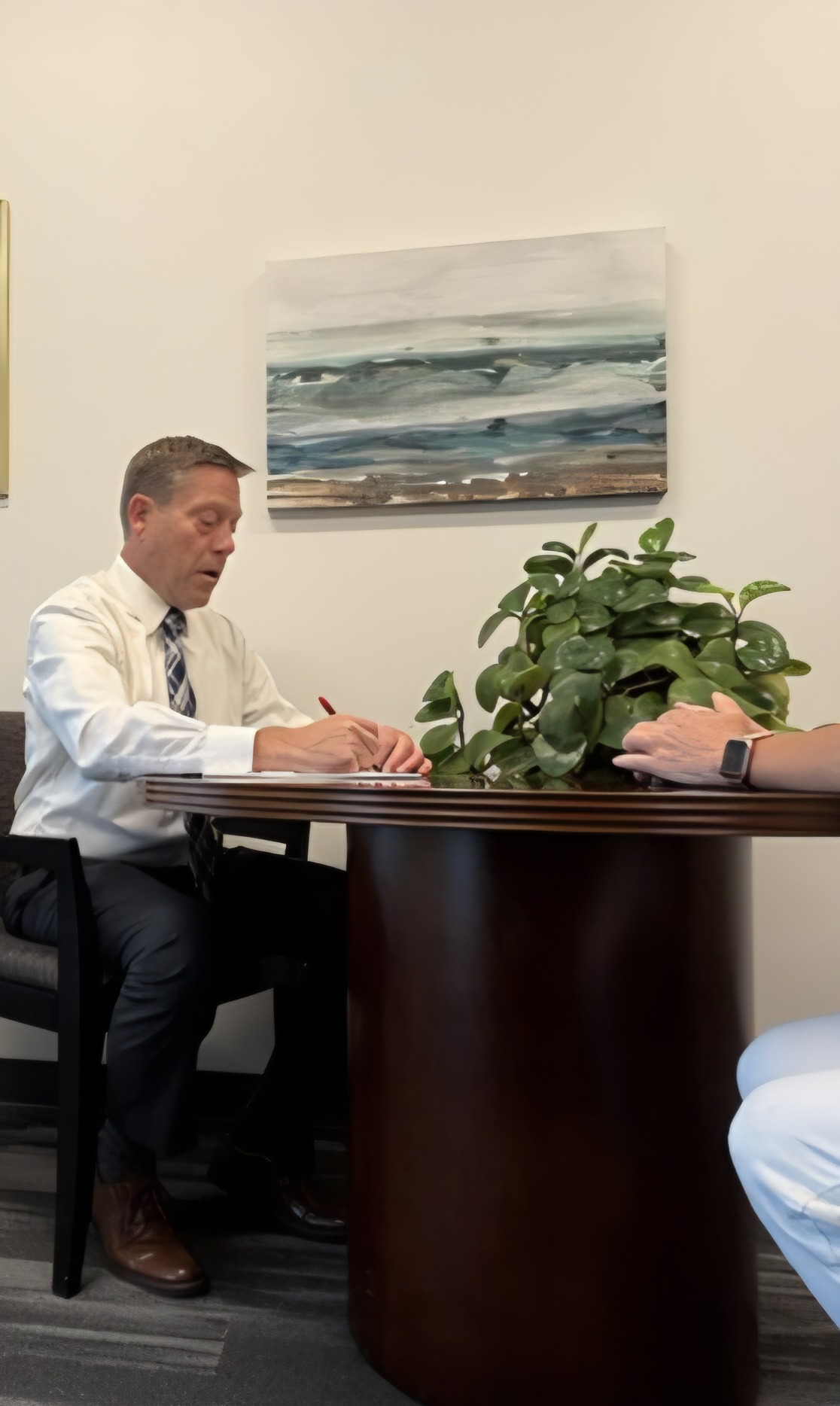 Attorney Hank Sand interacting with someone